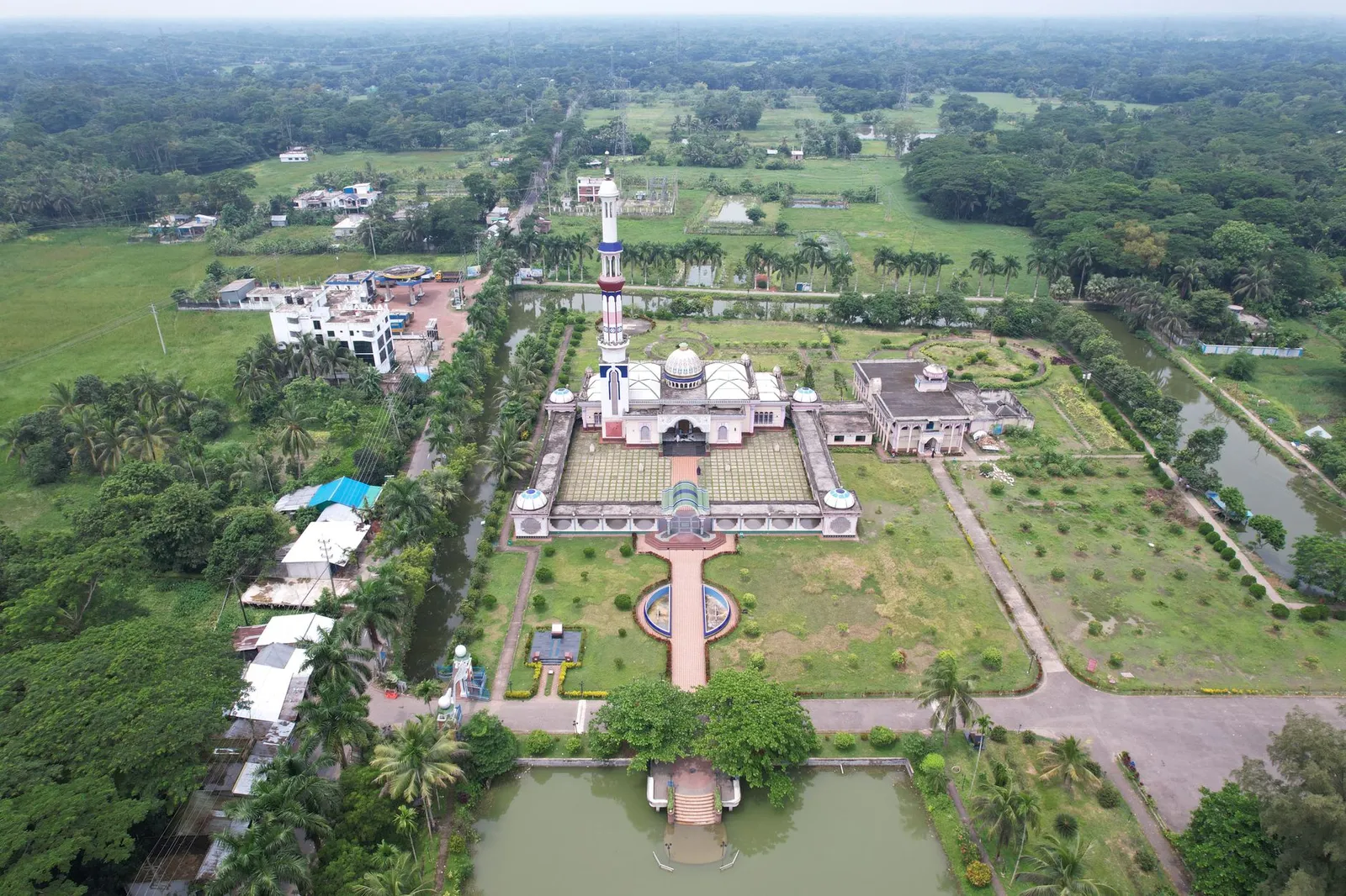Aerial view of a mosque among green fields and ponds in Barishal — the division an SEO expert in Barishal helps local businesses get found in