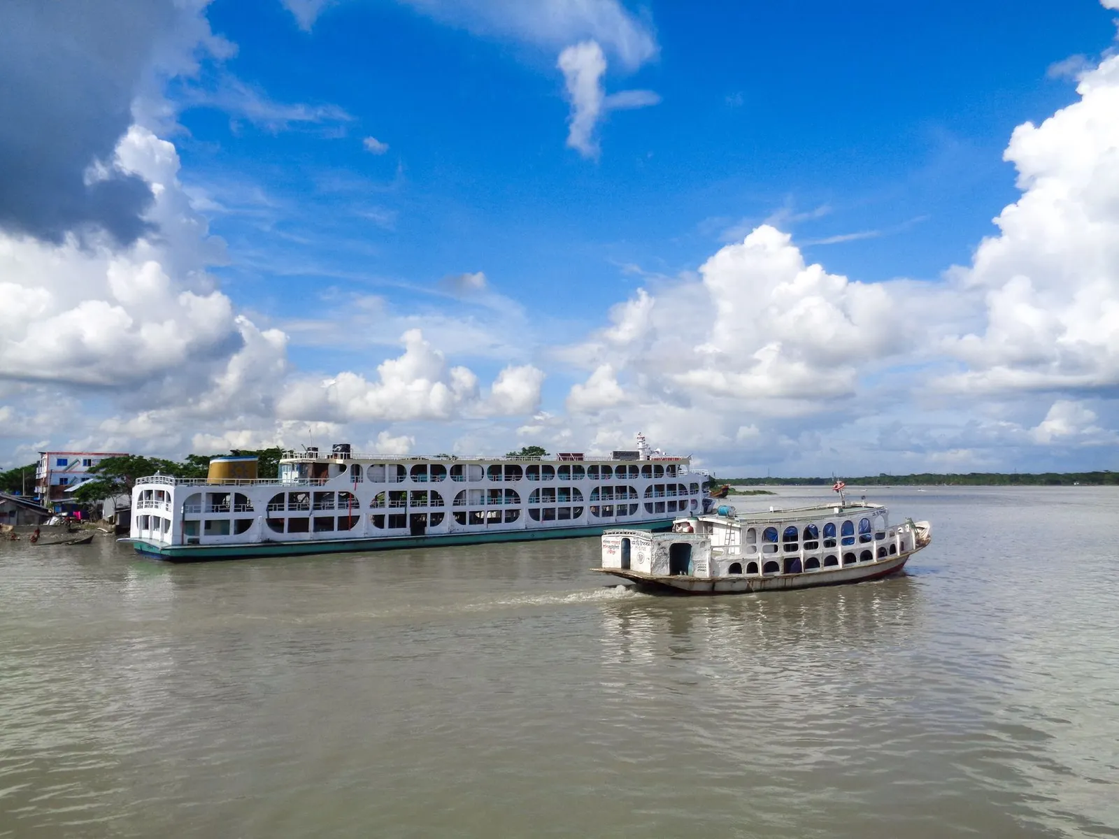 Passenger ferries on the Kirtankhola River in Barishal — the river city a remote web designer in Barishal builds business websites for