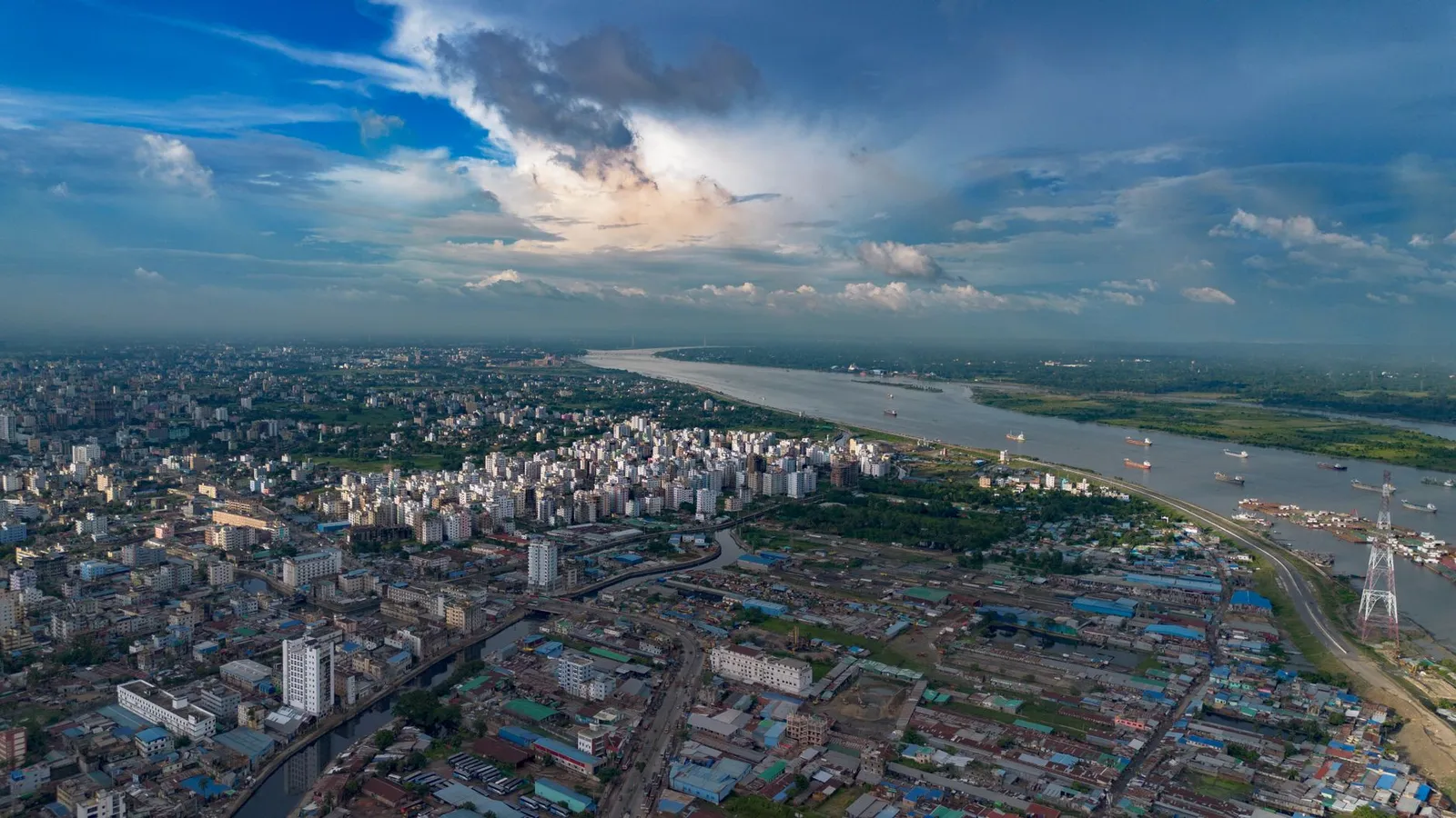 Aerial view of Chattogram city beside the Karnaphuli River — the port city a remote web designer in Chattogram builds business websites for