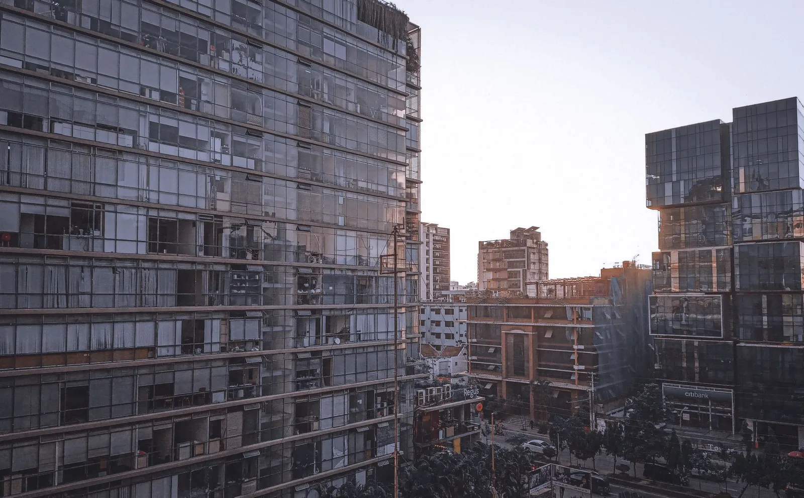 Glass office towers in Dhaka at sunset — the competitive market a remote SEO expert in Dhaka helps local businesses get found in
