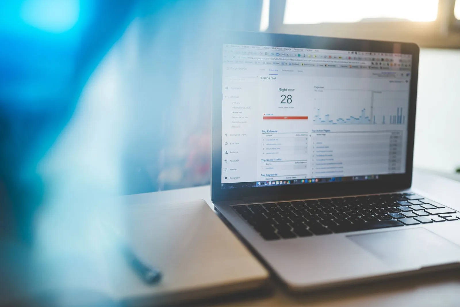 Google Analytics report open on a laptop — the kind of monthly numbers an SEO report explains