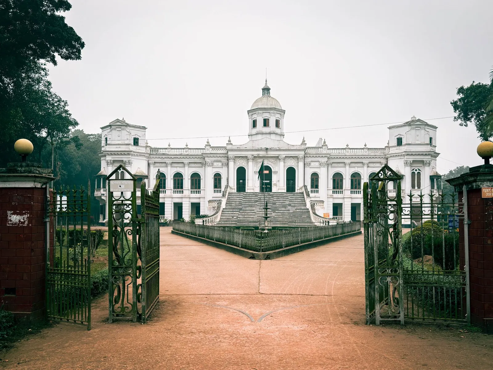 Tajhat Palace in Rangpur behind its open iron gates — the city a remote web designer in Rangpur builds business websites for